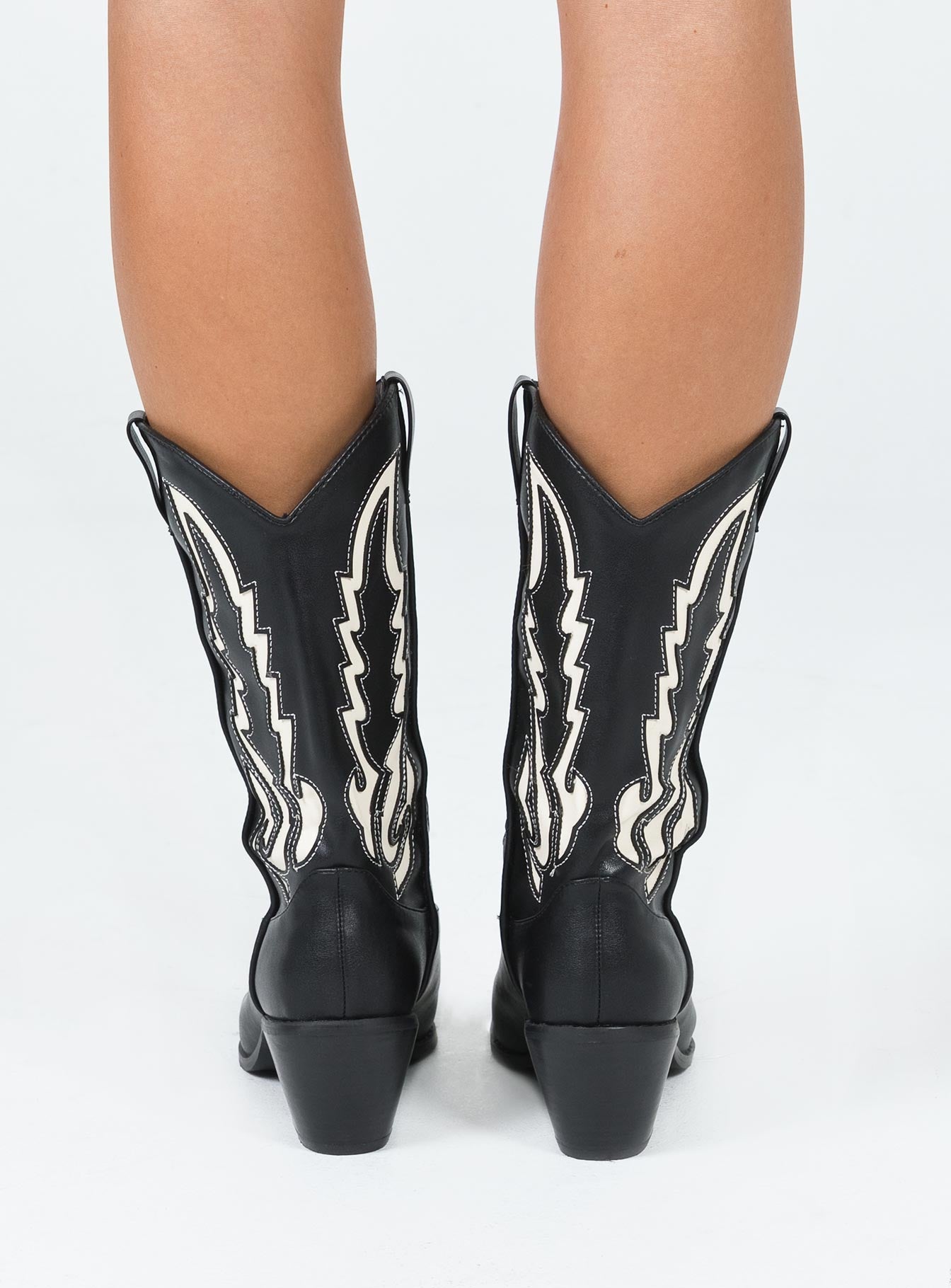 Cowgirl boots Faux leather material  Detail stitching  Mid-calf length  Pull tabs  Pointed toe Block heel 