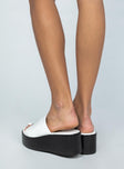 Platform heels Wide base Single thick upper Rounded toe Vegan leather