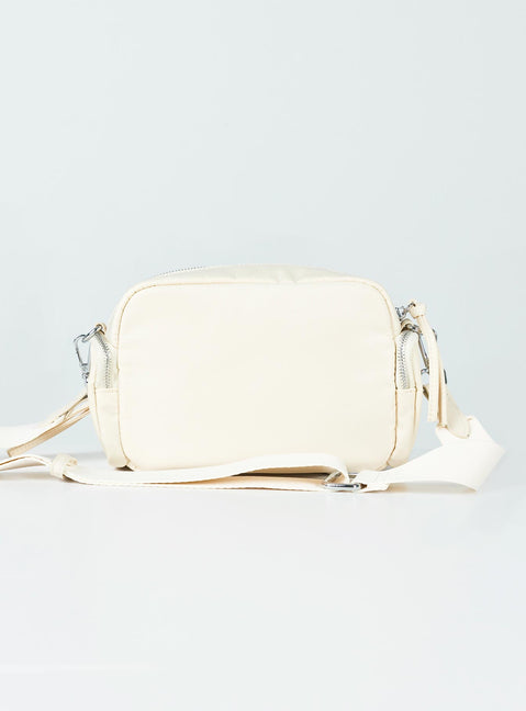 Crossbody bag Nylon material Silver-toned hardware Zip fastening Front & side pocket detailing Adjustable & removable crossbody strap Inner pocket zip fastening Flat base with feet studs