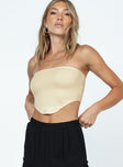 Front view of model wearing  front Princess Polly Sleeveless Asymmetric Neckline  Baram Strapless Top Cream