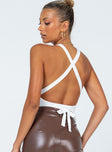 back view of model wearing Princess Polly Elon Bodysuit White Sleeveless V-Neck 