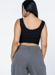 back view of model wearing Princess Polly Auburn Top Black Sleeveless Scoop Neck 