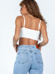 White crop top Ribbed material  Adjustable shoulder straps  Pointed hem 