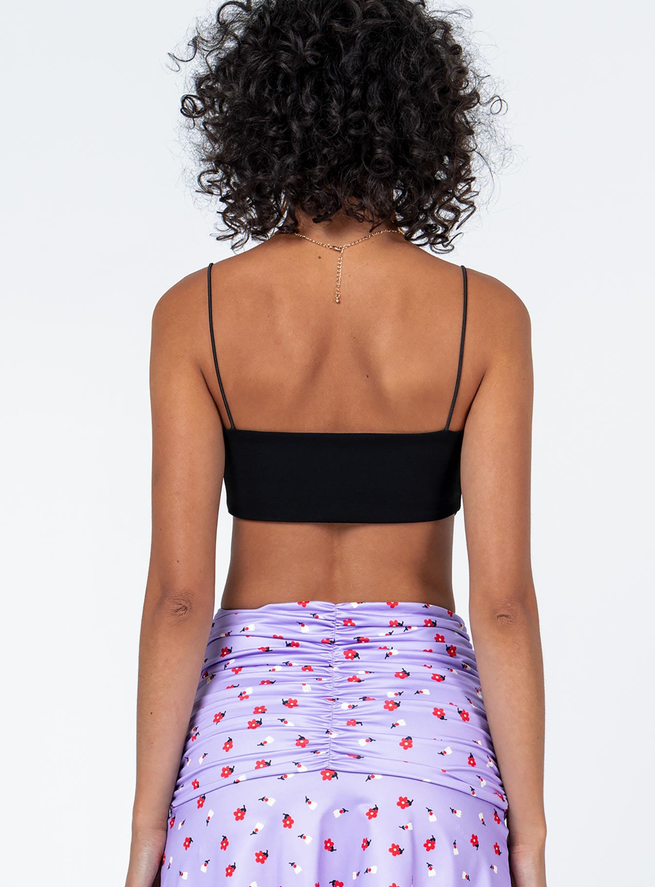 back view of model wearing Princess Polly McKinnon Top Black Sleeveless Square Neck 