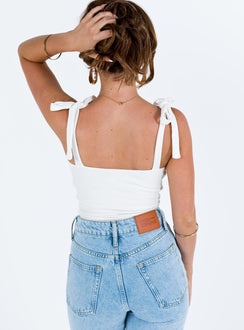 back view of model wearing Princess Polly Clove Tie Up Bodysuit White Petite Sleeveless Scoop Neck 