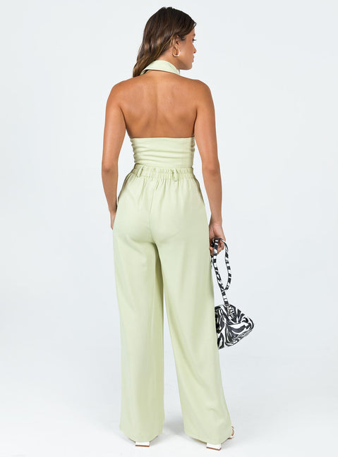 Green matching set High waisted pants  Zip & button fastening  Elasticated back band  Belt looped waist  Twin hip pockets Wide leg  Vest top  Lapel collar  Button front fastening 