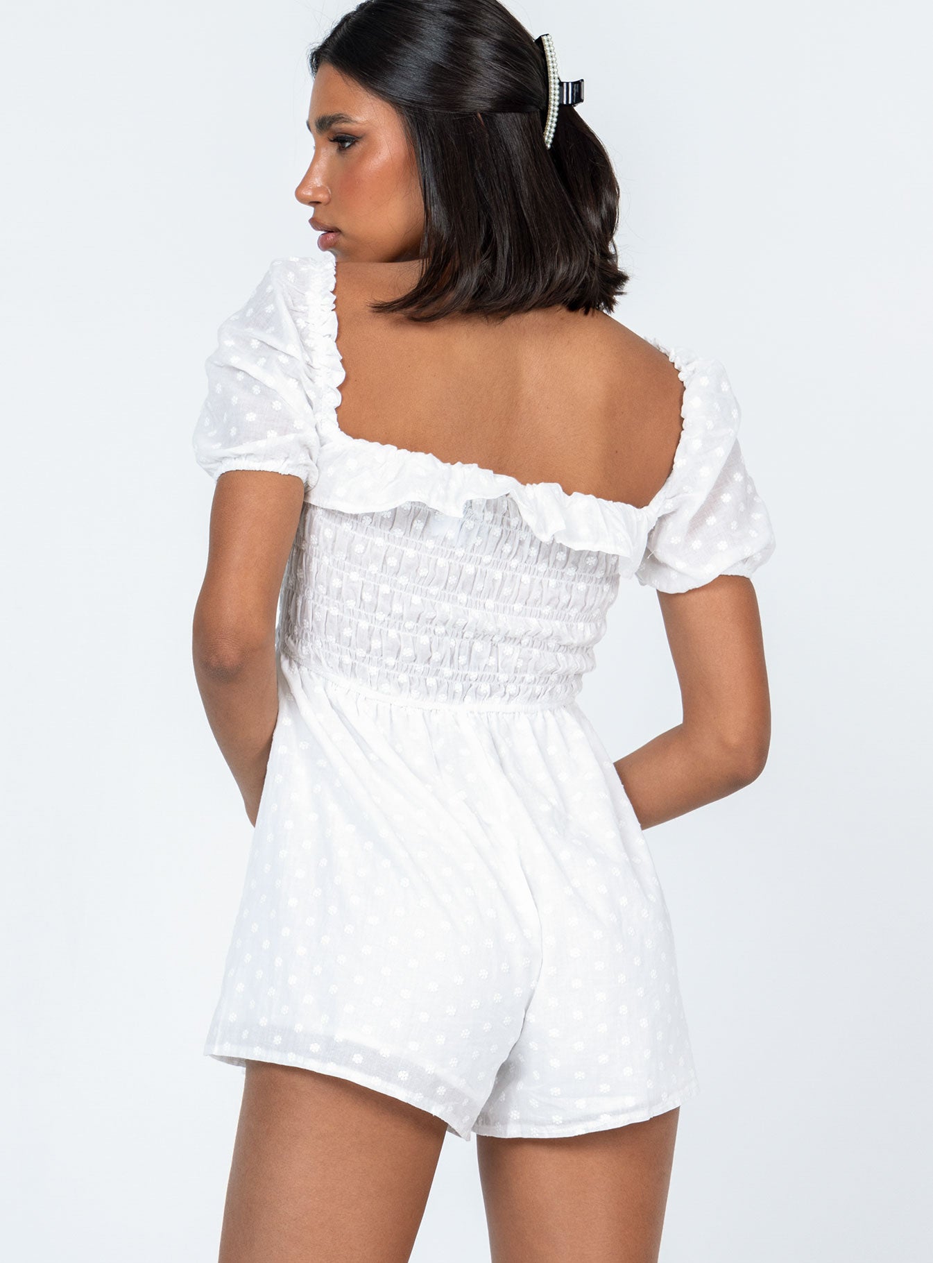 White romper Sheer design  Floral stitched material  Elasticated shoulders Puff sleeves Frill neckline  Shirred bust Fixed tie at waist 