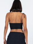 back view of model wearing Princess Polly Stephano Top Black Sleeveless Sweetheart 