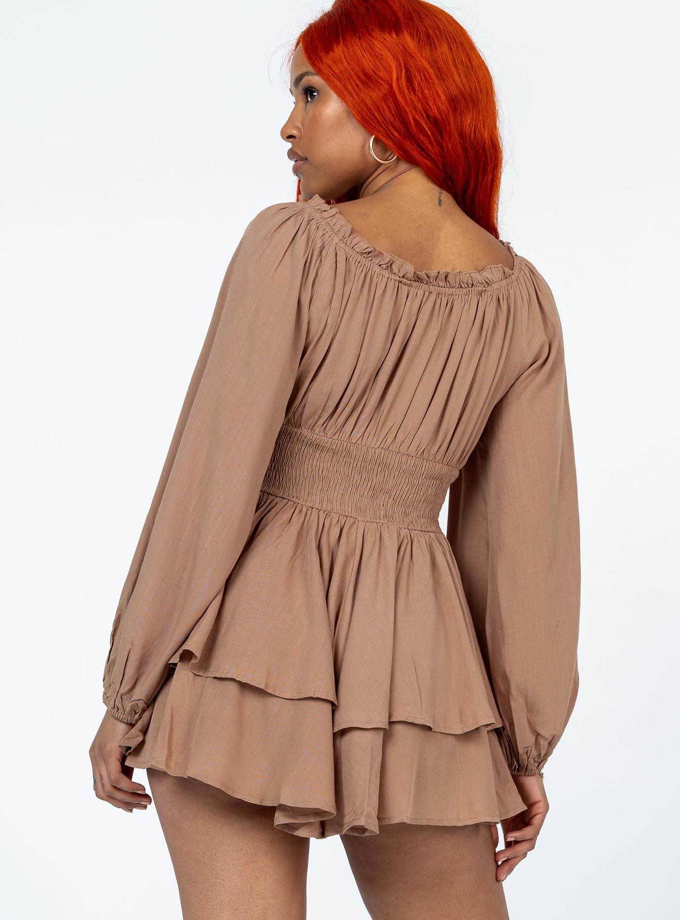 Romper Elasticated neckline  Boning through waist Shirred waistband at back  Layered skirt 