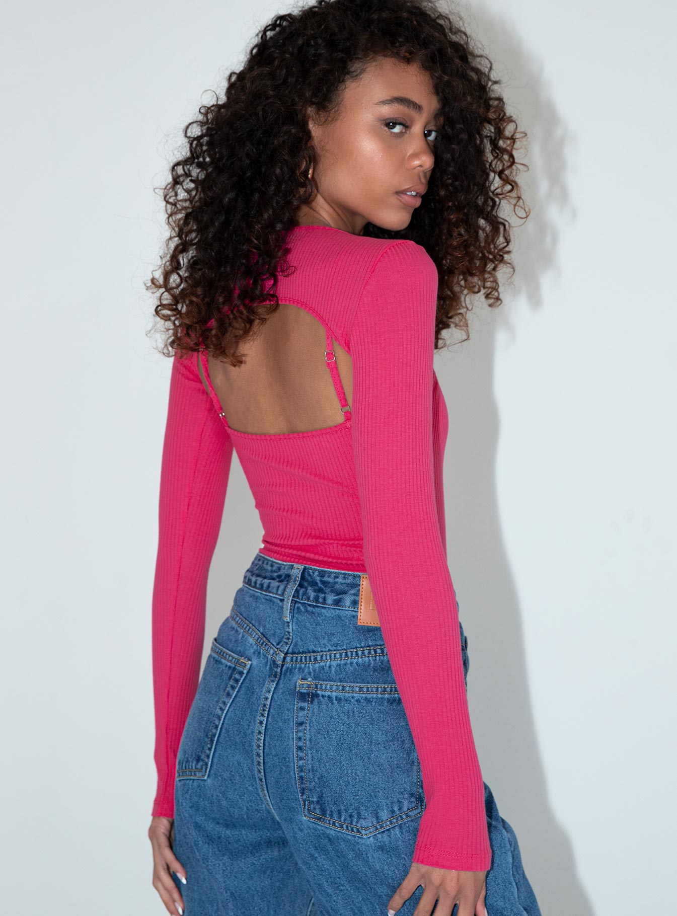 back view of model wearing Princess Polly Calla Long Sleeve Bodysuit Pink Full Sleeves Crew Neck 
