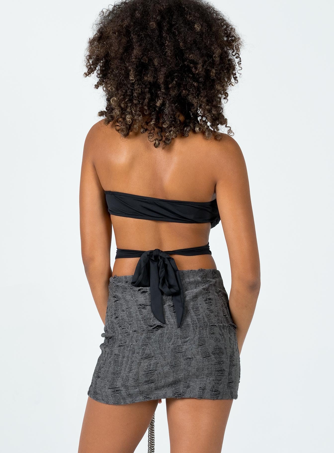 back view of model wearing Princess Polly Conan Mini Skirt Black Mini Skirts 