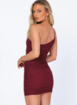 back view of model wearing Princess Polly Jocasta Mini Dress Burgundy Asymmetric Neckline 