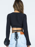 back view of model wearing Princess Polly Delano Long Sleeve Top Black Full Sleeves V-Neck 