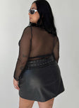 Front view of model wearing  front Torridon Eyelet Belt Faux Leather Mini Skirt Black Curve Princess Polly  Mini Skirts 