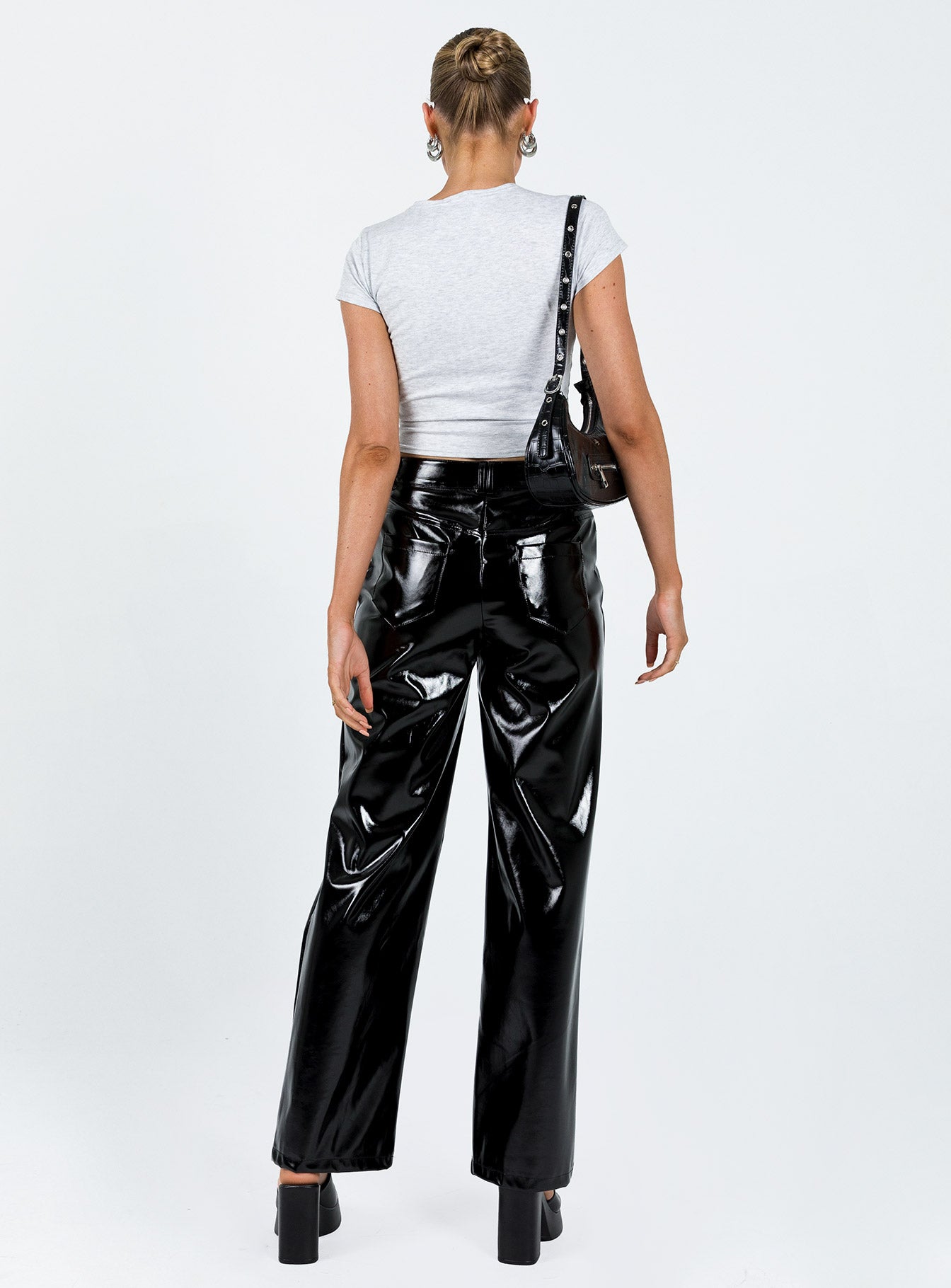Front view of model wearing  front Princess Polly  Renni Low Rise Vinyl Pants Black