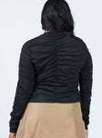 Long sleeve top Sheer textured material Open front with tie fastening Ruched detailing throughout Split hem