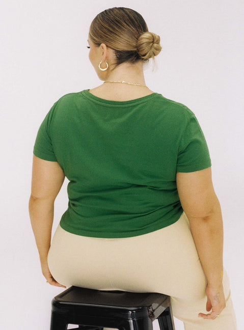 back view of model wearing Princess Polly Organic Protect Charity Baby Tee Green Curve Short Sleeves Crew Neck 