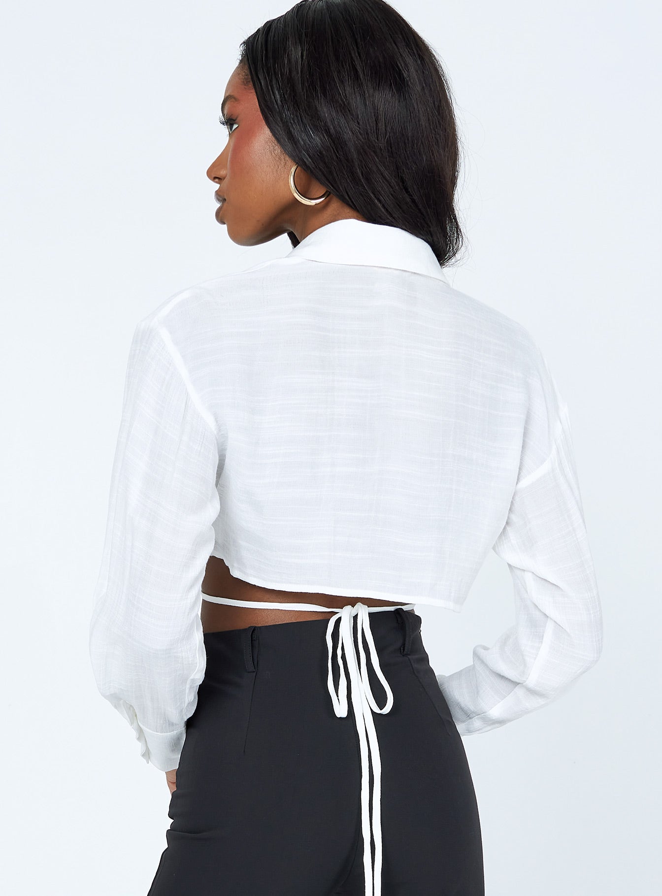 back view of model wearing Princess Polly Caprice Long Sleeve Top White 