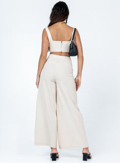 Matching set Silky material  Corset top  Boning through front  Zip fastening at back  High waisted pants  Invisible zip fastening at side  Wide leg 