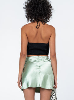 back view of model wearing Princess Polly Keelia Mini Skirt Green Mini Skirts 