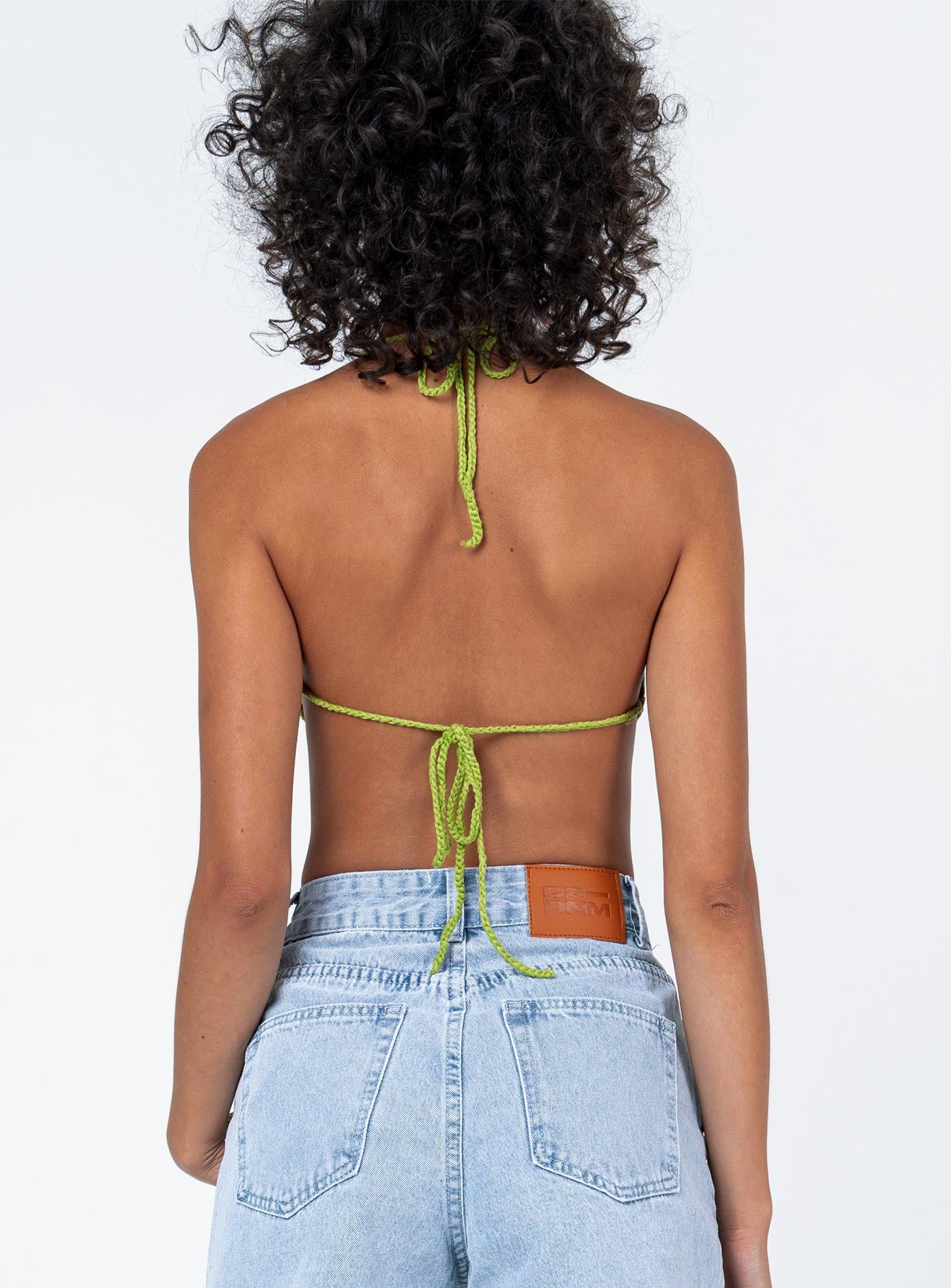 back view of model wearing Princess Polly Vermont Top Green Sleeveless Scoop Neck 