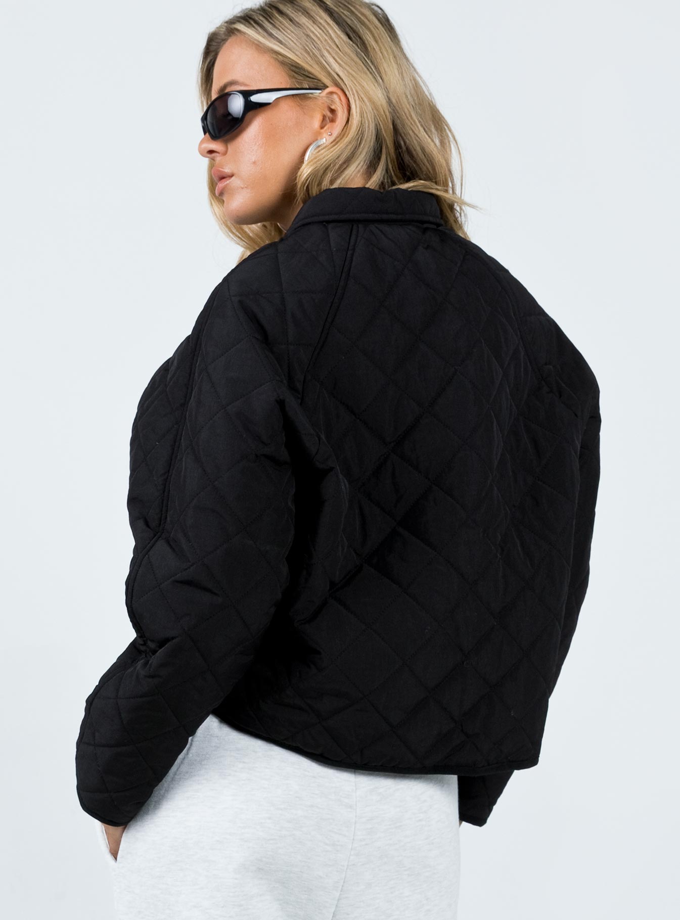 Cropped jacket Quilted material Pointed collar Press button fastening Twin hip pockets Non-stretch