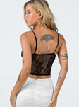 Crop top Sheer lace material Adjustable shoulder straps Plunging neckline Good stretch