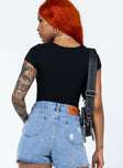 back view of model wearing Princess Polly Nicola Bodysuit Black Short Sleeves Crew Neck 