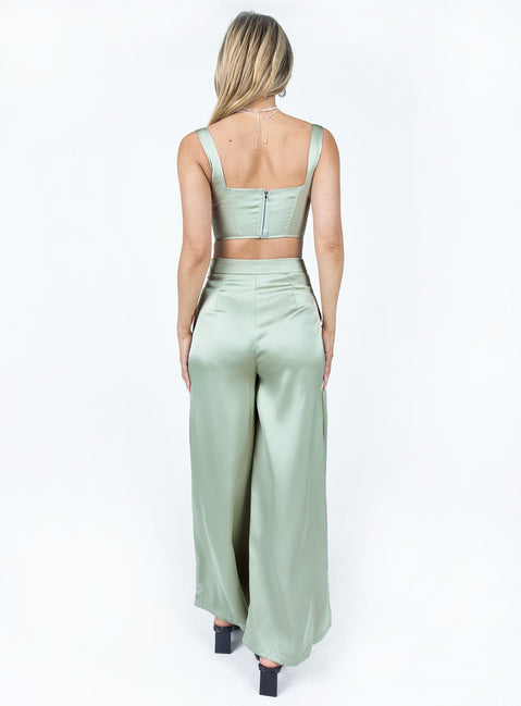 Matching set Silky material  Corset top  Boning through front  Zip fastening at back  High waisted pants  Invisible zip fastening at side  Wide leg 