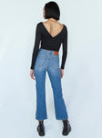 back view of model wearing Princess Polly Arizona Flare Denim Jeans Mid Rise 