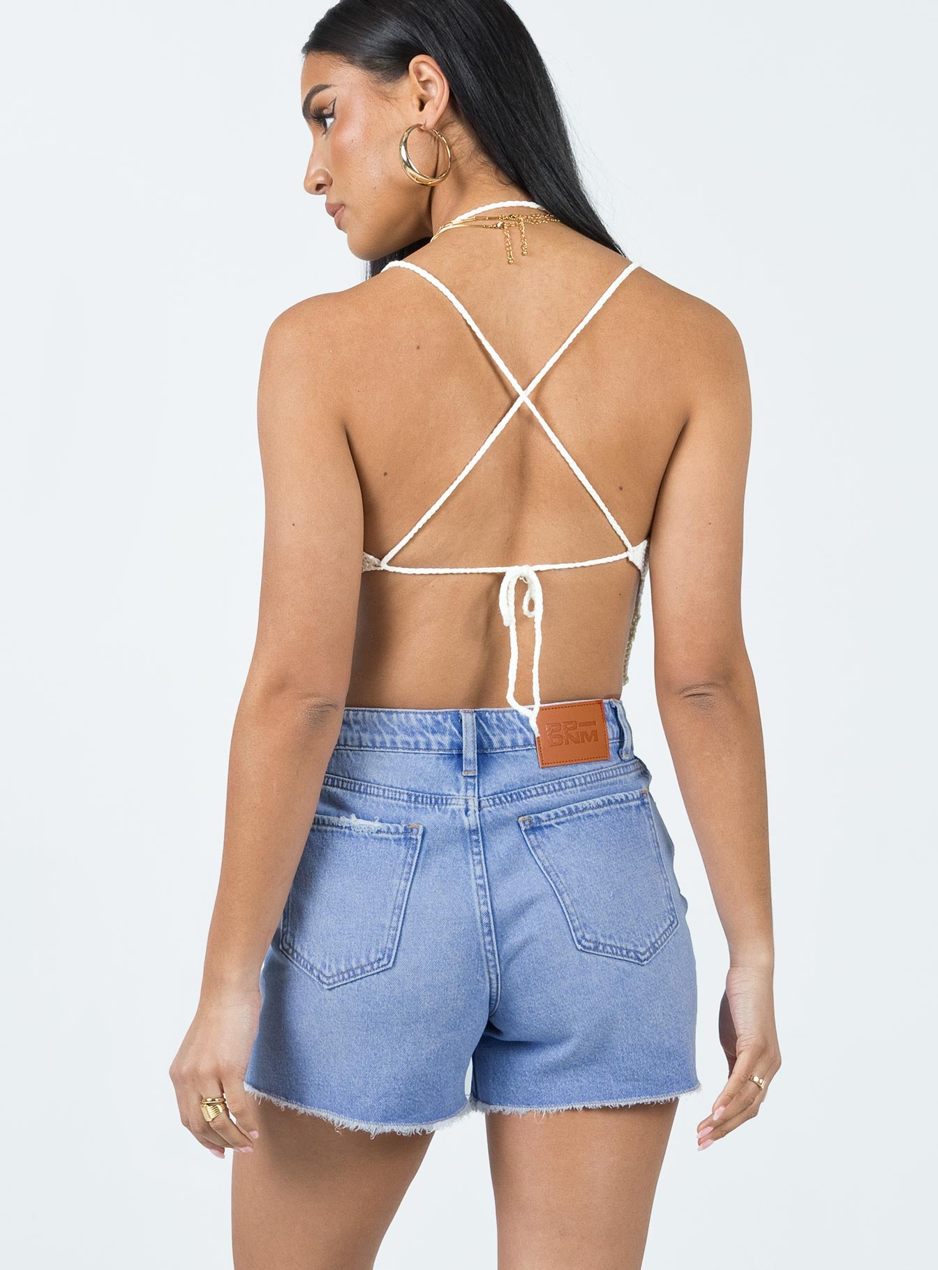 Denim shorts Mid wash denim High waisted design Belt looped waist Zip & button fastening Classic five-pocket design Distressed detail Raw edge hem