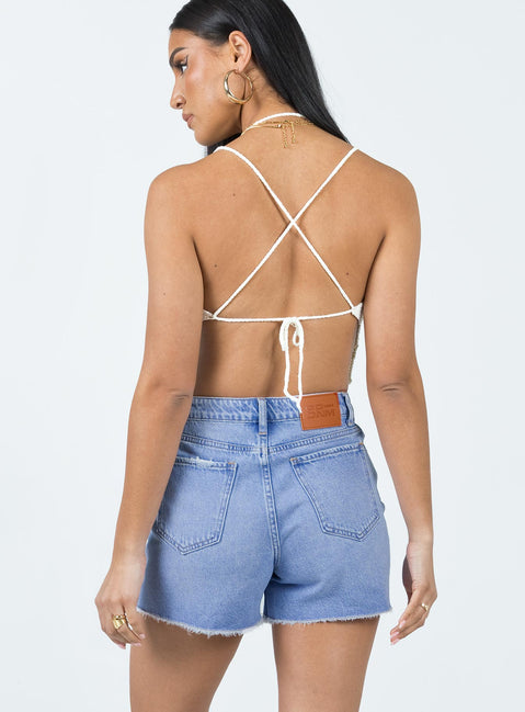 Denim shorts Mid wash denim High waisted design Belt looped waist Zip & button fastening Classic five-pocket design Distressed detail Raw edge hem