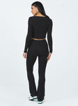 Matching set Soft knit material  Long sleeve top  Wide neckline  Tie fastening at bust  High waisted pants  Flared leg 