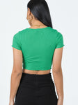 Crop top Ribbed material V-neckline Button fastening at front Lettuce edge hem