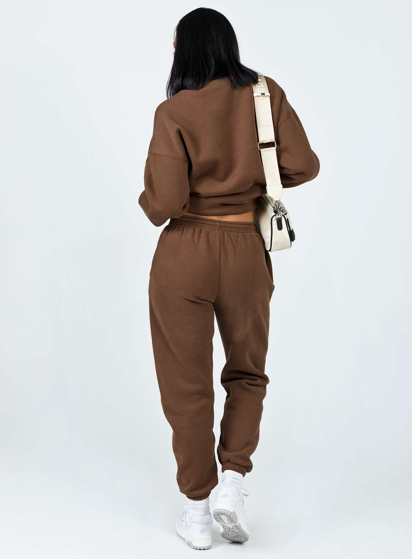 back view of model wearing Princess Polly Club Basic Trackpants Brown 
