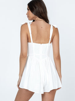 Romper Tie shoulder straps  Tie at bust  Fitted waist  Invisible zip fastening at back  Non-stretch