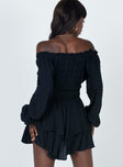 Long sleeve romper Soft textured material Shirred waistband Ruffle detailing Elasticated neck and sleeves Can be worn on or off shoulder Layered ruffle hem
