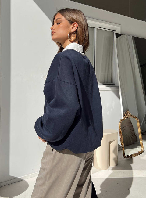 side view of model wearing Princess Polly New York Crewneck Sweatshirt Navy regular 
