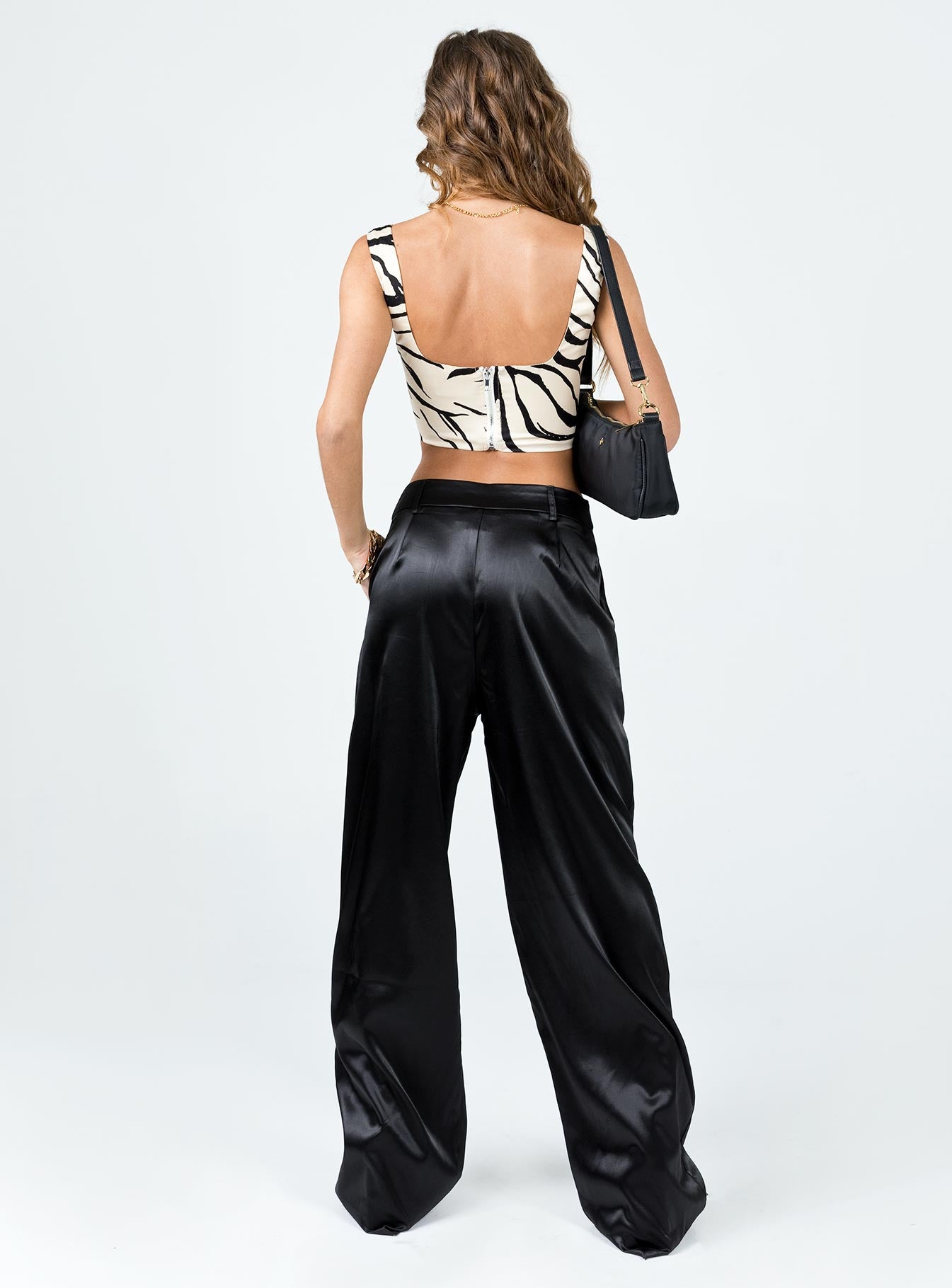 back view of model wearing Princess Polly Archer Pants Satin Black 