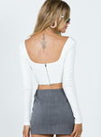 Long sleeve bustier Ribbed material Square neckline Boning through front Zip fastening at back Pointed hem Good stretch
