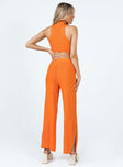 Matching set Ribbed material Tank top Mock neck Low cut sides High waisted pants Elasticated waistband Wide leg Slits at cuff