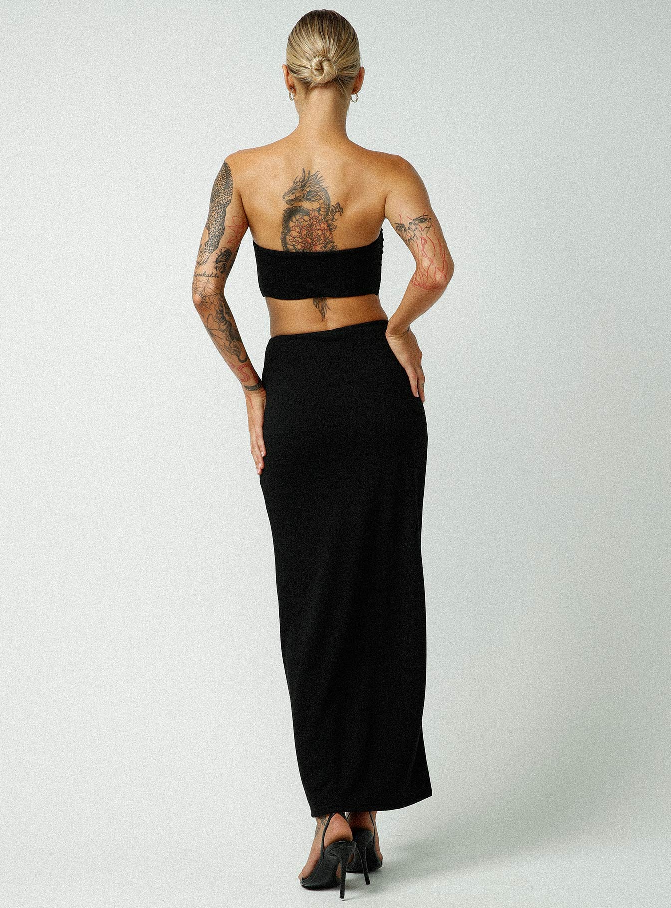 back view of model wearing Princess Polly Jagger & Stone Claudia Maxi Skirt Black Maxi 
