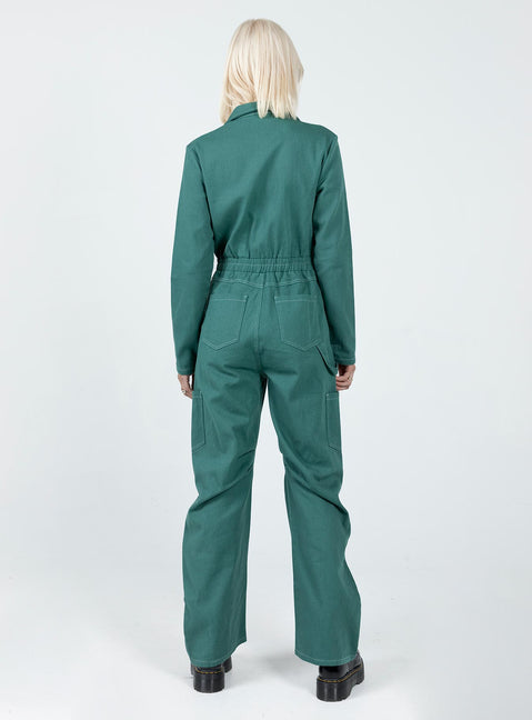Boiler suit 100% cotton Relaxed fit Contrast stitching  Classic collar  Zip front fastening  Twin chest pockets  Six leg pockets  Elasticated waistband   Wide leg  Pleated detail at inner leg 