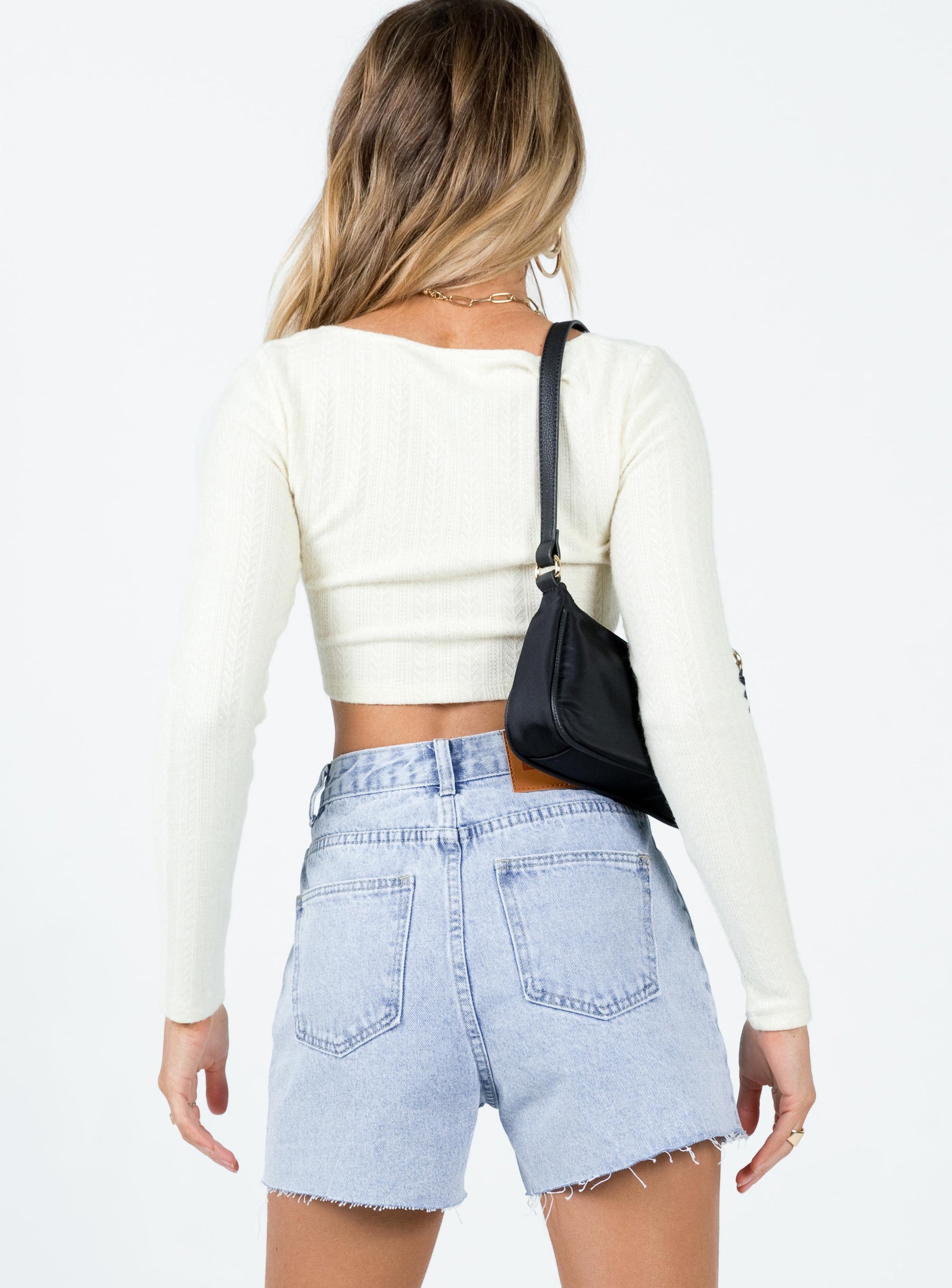 Shorts 100% cotton Asymmetrical zip & button fastening High waisted Light wash blue Belt looped waist Five-pocket design Distressed hem