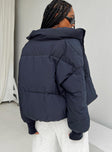 Puffer jacket High neck Zip front fastening Twin zip front pockets Ribbed cuffs Drawstring waist