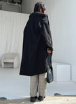 Oversized jacket Faux fur material Classic collar Press button fastening Twin hip pockets