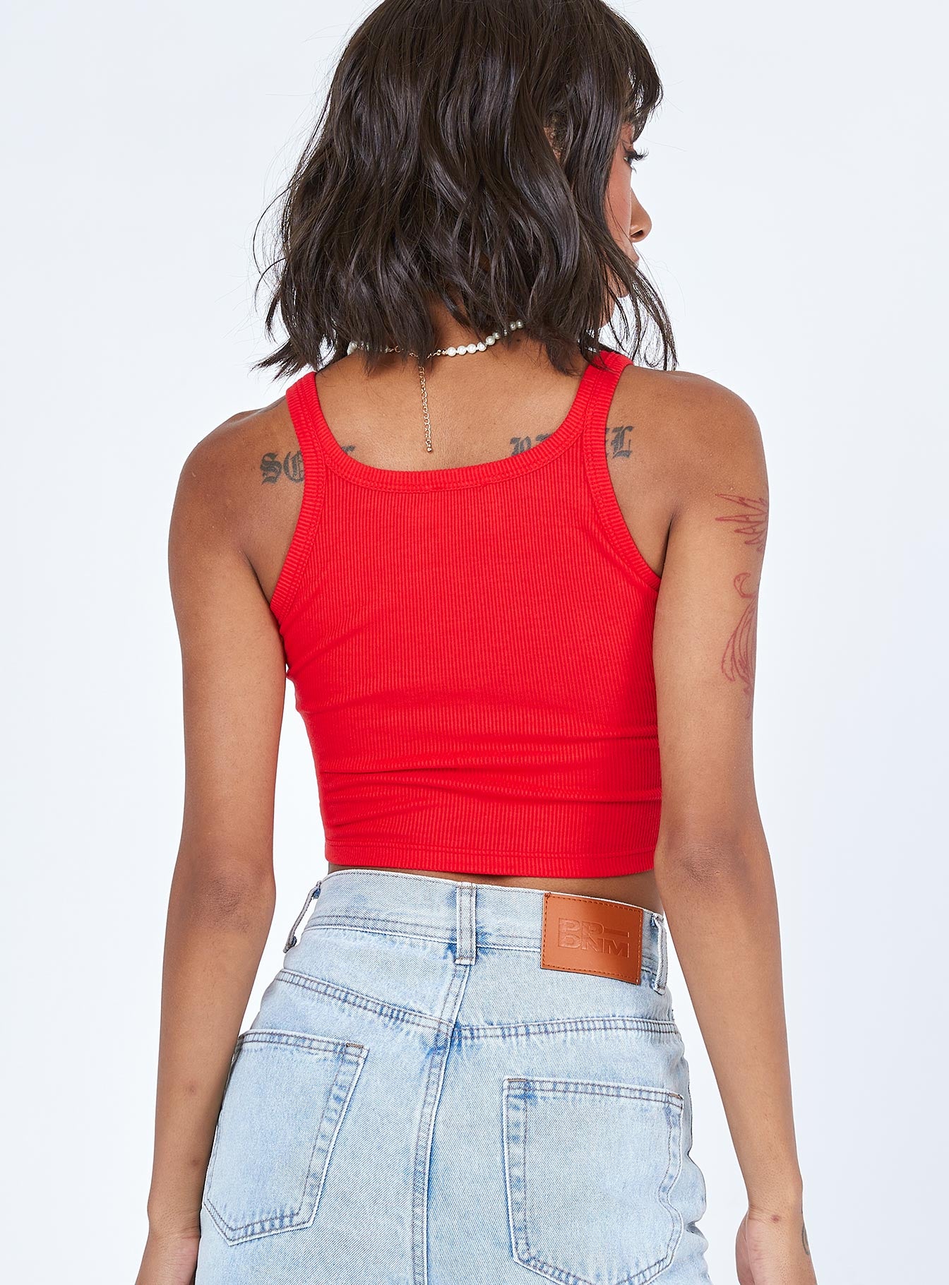 back view of model wearing Princess Polly Yosemite Tank Top Red 