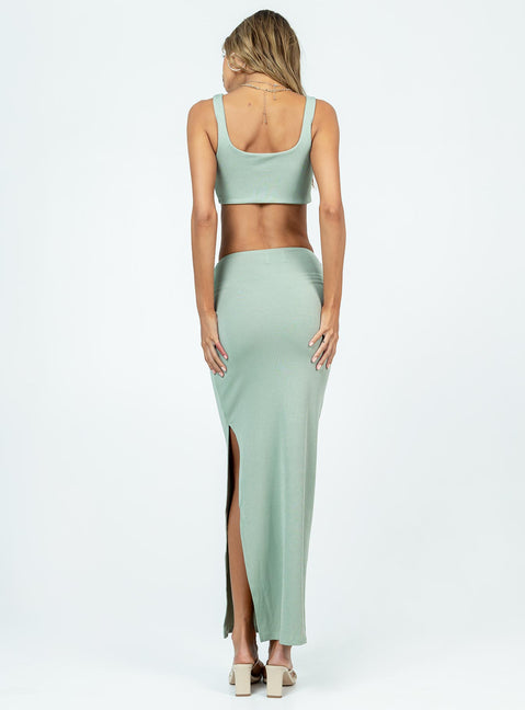 Matching set Ribbed material Crop top Twisted bust High waisted skirt High side slit  Twist detail at waist Lined top