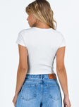 back view of model wearing Princess Polly Barcham Bodysuit White Short Sleeves Crew Neck 