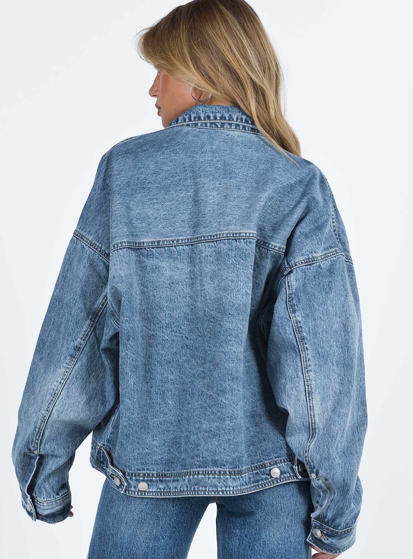 Oversized jacket Mid wash denim Classic collar Drop shoulder Button fastening at front Oversized chest pocket Single button cuff